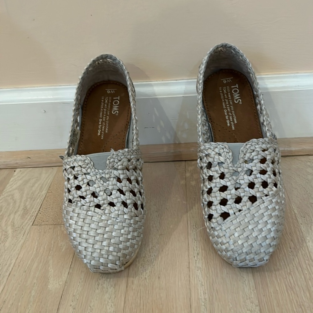TOMS silver woven shoes.